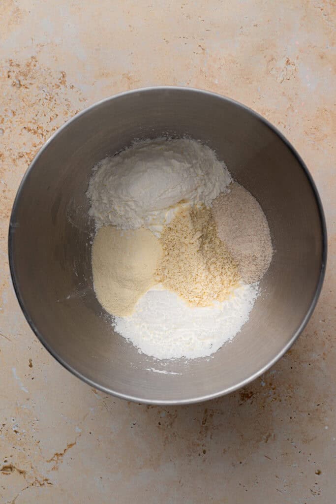 gluten free buttermilk biscuit dry dough ingredients in a silver bowl
